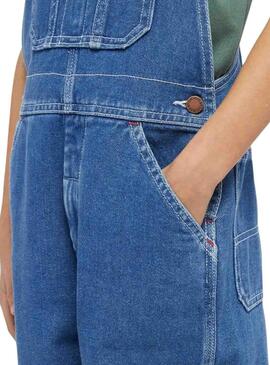 Salopette Dickies en jean bleu lavé pour fille.