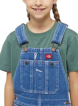 Salopette Dickies en jean bleu lavé pour fille.