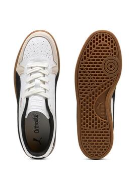 Chaussures Puma Indoor blanches pour hommes.