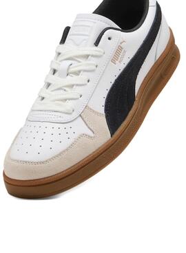 Chaussures Puma Indoor blanches pour hommes.