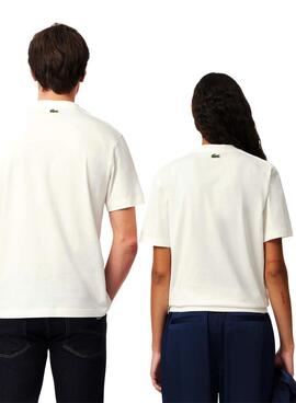 T-shirt Lacoste avec logo imprimé blanc pour homme et femme.