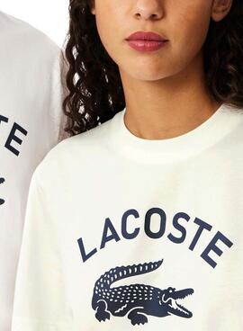 T-shirt Lacoste avec logo imprimé blanc pour homme et femme.