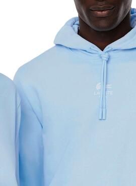 Sweat à capuche Lacoste à imprimé bleu pour homme et femme.