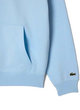 Sweat à capuche Lacoste à imprimé bleu pour homme et femme.