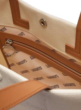 Sac fourre-tout Lacoste en toile beige de grande taille.