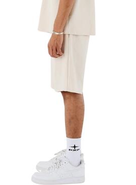 Proyecto Bermuda X Paris en punto beige para hombre.