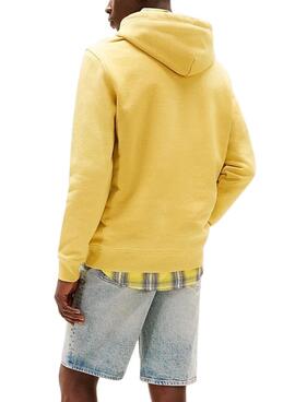 Sweat à capuche Tommy Jeans Badge jaune pour homme.