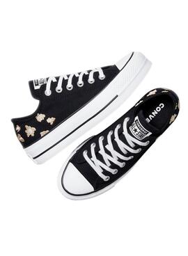S'il vous plaît, rendez-moi simplement la traduction en français de ceci : Baskets Converse Chuck Taylor All Star Plateforme Animal Print noir pour femmes