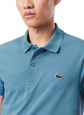 Polo básico Lacoste azul con cuello de canalé para hombre.