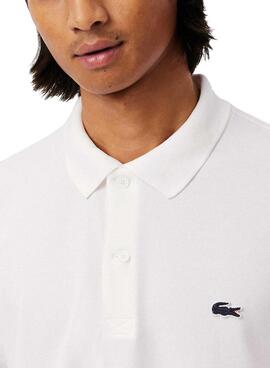 Polo Lacoste à manches côtes blanc pour homme.