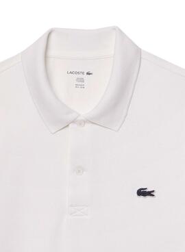 Polo Lacoste à manches côtes blanc pour homme.