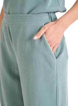 Pantalon Naf Naf Gala vert turquoise pour femme.