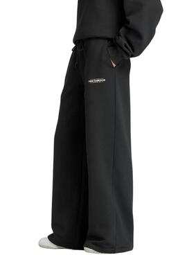 Pantalon New Balance Reimaginé noir pour femme.